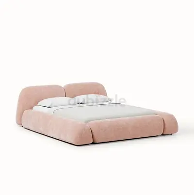 Low-profile upholstered double bed in soft pink (modern design)