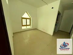 A spacious studio with a separate kitchen in Sharjah, featuring a practical layout that offers comfo