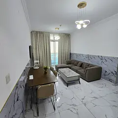 Furnished Two-bedroom apartment with living room for monthly rent in Ajman – Al Rashidiya | Bills