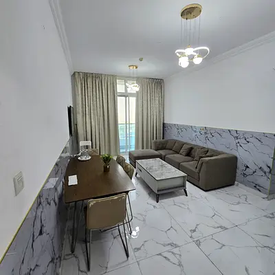 Furnished Two-bedroom apartment with living room for monthly rent in Ajman – Al Rashidiya | Bills included | Fully furnished | Gym, pool, parking.