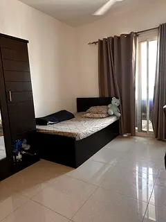 Furnished Master bedroom with attached bathroom and balcony  in Abu shagara
