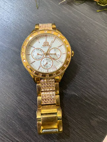Gold-tone women's wristwatch with crystal accents - preowned