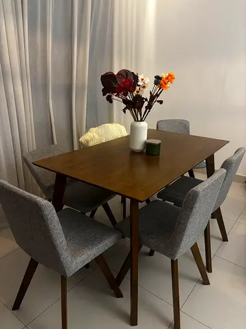 Wooden Dining Table with 6 Grey Upholstered Chairs - Good Condition. One chair back broken