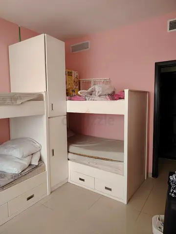 Custom-made children’s bedroom set with 4 beds, wardrobes, and storage cabinets — good condition