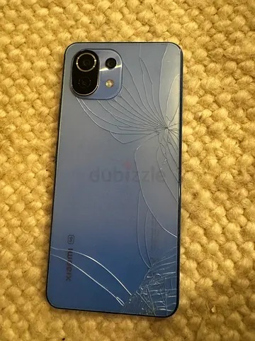 Xiaomi smartphone (back glass cracked) - working condition