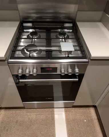 Stainless Steel 4-Burner Gas Cooker with Electric Oven (Good Condition)