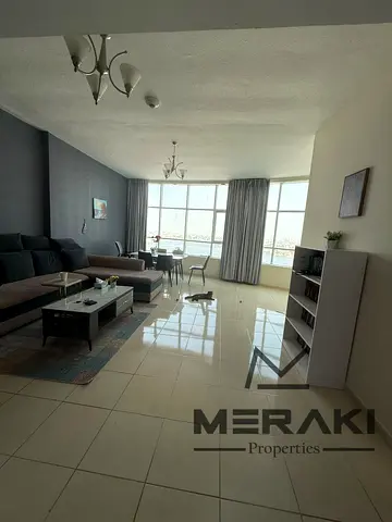 A premium 1-bedroom apartment at a special price with a sea view in Orient Towers, Ajman, with an attractive payment plan and private parking.