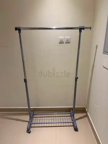 Simple freestanding double-rail clothes rack with bottom shoe shelf