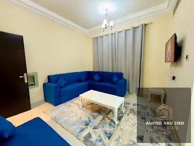 Furnished two-bedroom apartment with a large living room, central air conditioning, and a balcony o