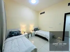 Furnished two-bedroom apartment with a large living room, central air conditioning, and a balcony of