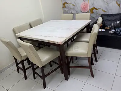 Dining table set with marble top and 8 cream chairs