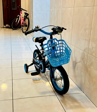 Children's 14-inch Blue Bike with Training Wheels and Front Basket in excellent condition.