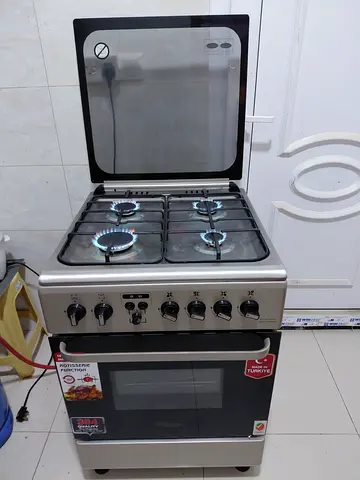 4 Burner with Oven and rotisserie accessories good condition