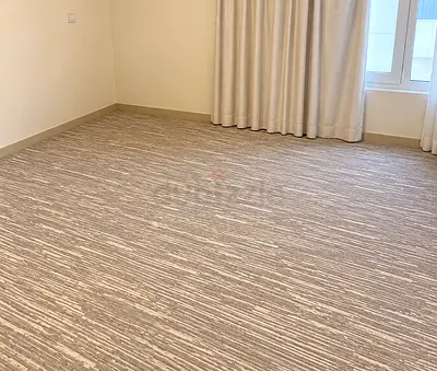 2/ Light beige textured wall-to-wall carpet — excellent condition