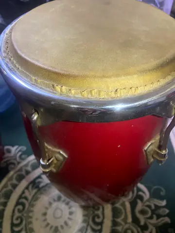 Handheld bongo drum - single conga-style drum, used