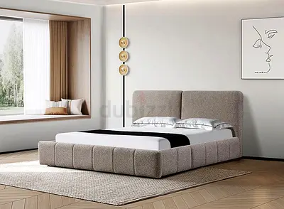 Modern upholstered queen bed with padded headboard — beige