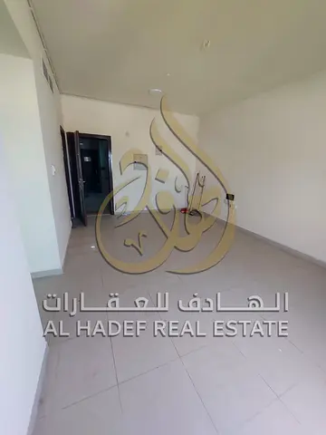 A spacious one-bedroom apartment with a living room is available for rent in Al Khan, SharjahBalcony offering additional outdoor space.