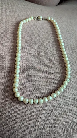 Classic single-strand pearl necklace with silver clasp