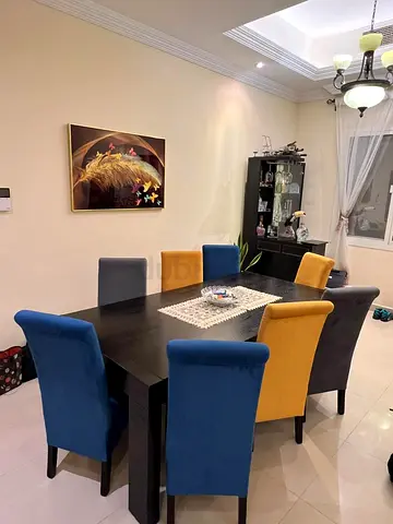 Home Centre wood dining table and 8 chairs in good condition