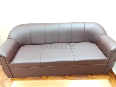 Brown faux leather 3-seater sofa in good condition
