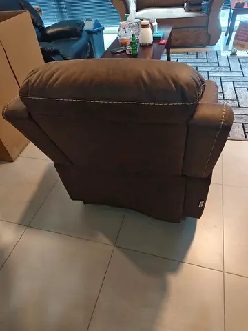 Brown single-seater recliner armchair in good used condition