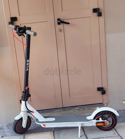 White electric scooter in good condition, single rider