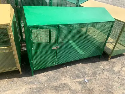 Large green outdoor metal rabbit/rodent cage with roof and latch