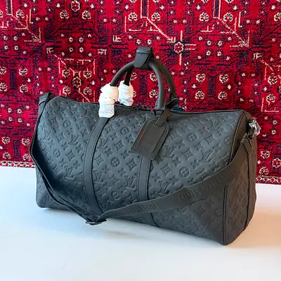 Luxurious Louis Vuitton Black Duffel Bag - A Must-Have!