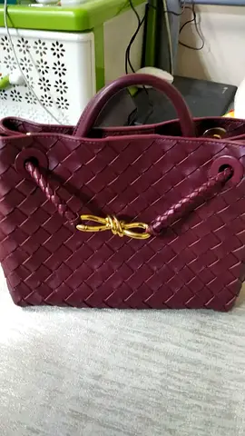 Maroon woven tote handbag with gold bow detail - good condition