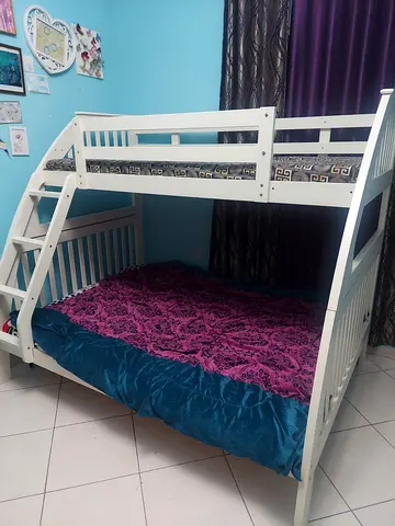 White wooden bunk bed with mattress