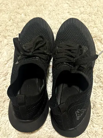 Black slip-on knit sneakers, lightly used