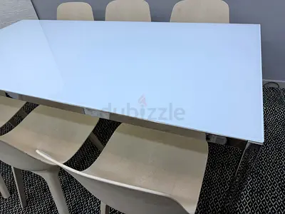 White glass dining table with 6 beige chairs - modern set