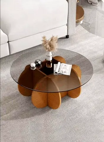 Round glass coffee table, wooden petal base