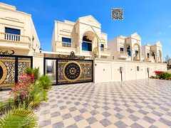Classic villa for sale in Ajman, featuring 5 master bedrooms, a majlis, a living room, and a maid's