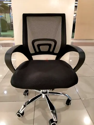 Black mesh ergonomic office chair with chrome base
