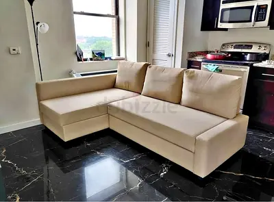 Beige L-shaped Sofa bed with Chaise - Good Condition