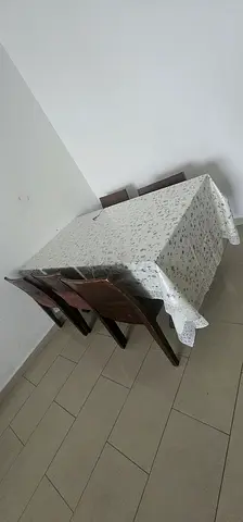Wooden dining table with 5 chairs - compact set in good condition