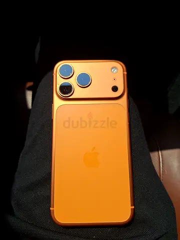 iPhone with orange MagSafe case — excellent condition No Sim Restrictions