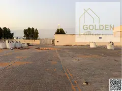 107,450 Sq. Ft. Industrial Yard | Front & Rear Road Access | Ready for Operation – Al Sajaa