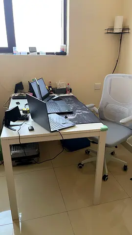 White ergonomic table and mesh office chair — good condition