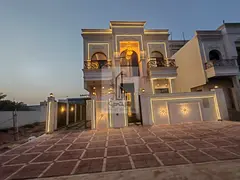 Luxury villa with dual stone facades for sale, directly facing Al Safeer Mall—situated on a street