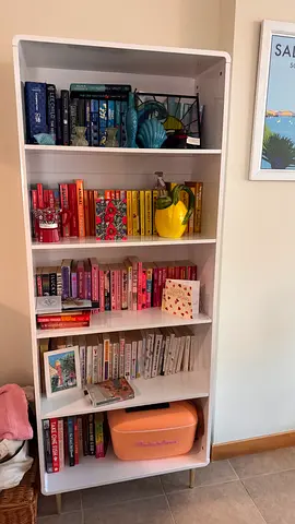 White bookshelf with gold feet