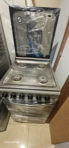 4-Burner Stainless Steel Gas Stove with Oven - Good Condition