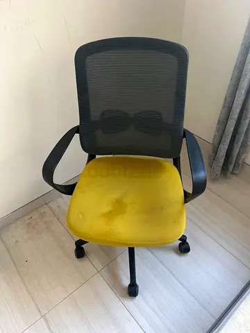 Used ergonomic mesh office chair with yellow seat