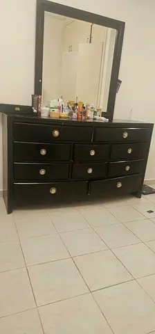 Black wooden dresser with mirror - 10 drawers, good condition