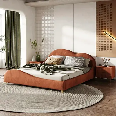 Low-profile upholstered double bed with curved headboard (rust orange)