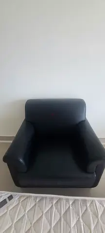 Comfortable single black leather armchair - good condition
