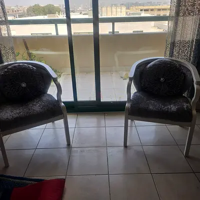 Pair of grey upholstered accent chairs with white frame - good condition