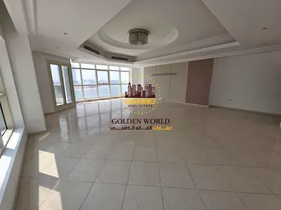 For Rent in Al Khan, Sharjah, a spacious and elegant three-bedroom apartment with a living room, designed for families seeking comfort and premium l