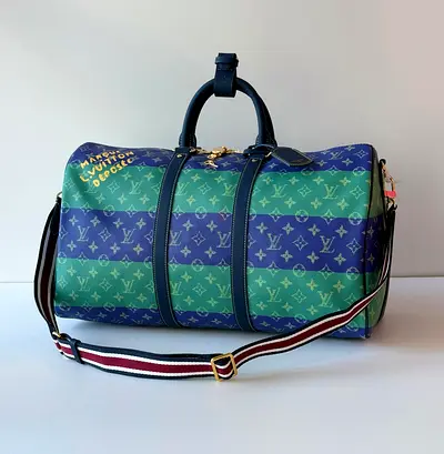 Luxurious Louis Vuitton Green Duffel Bag - A Must-Have!